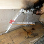 Moisture meter checking drywall