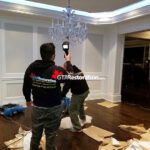 Technician inspecting a ceiling
