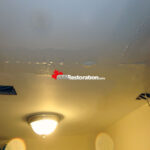 Technician inspecting wall cavity