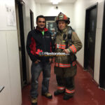 Air movers drying flooring after firefighting water