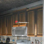 Damaged kitchen cabinets after residential fire
